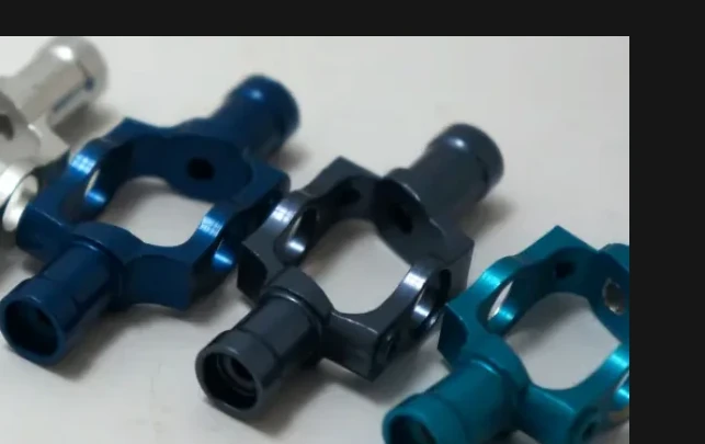 Anodized machined components with blue surface finish